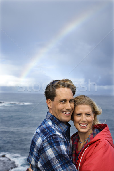Stockfoto: Paar · glimlachend · regenboog · kaukasisch · permanente · oceaan