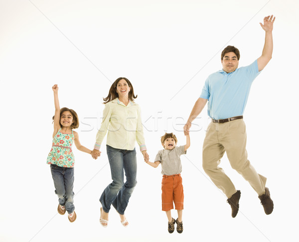 семьи прыжки улыбаясь , держась за руки девушки ребенка Сток-фото © iofoto
