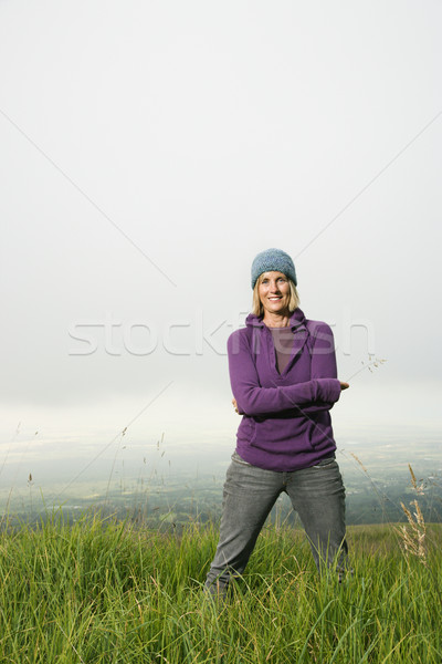 Woman in field. Stock photo © iofoto