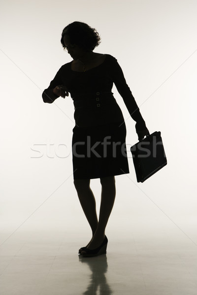 Businesswoman checking time. Stock photo © iofoto