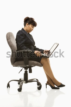üzletasszony laptop középkorú ül irodai szék fehér Stock fotó © iofoto