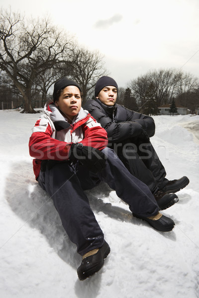 Boys sitting in snow. Stock photo © iofoto