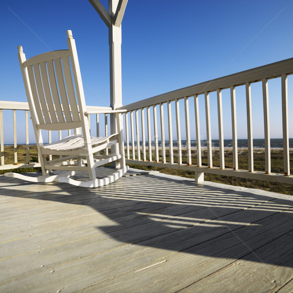 Rocking chair on porch. Stock photo © iofoto