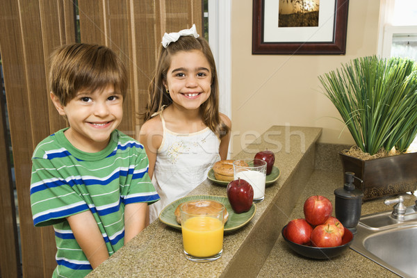 Kids eating breakfast. Stock photo © iofoto