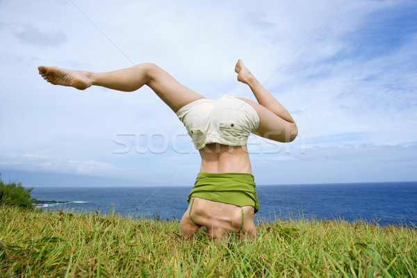 Woman doing headstand. Stock photo © iofoto