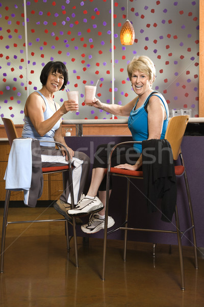 Women drinking smoothies. Stock photo © iofoto