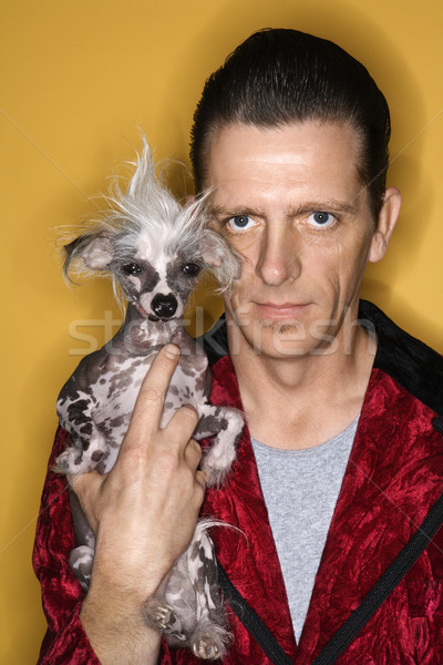 Man holding Chinese Crested dog. Stock photo © iofoto