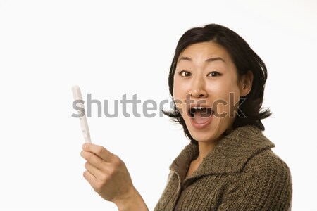 Woman holding pregnancy test. Stock photo © iofoto