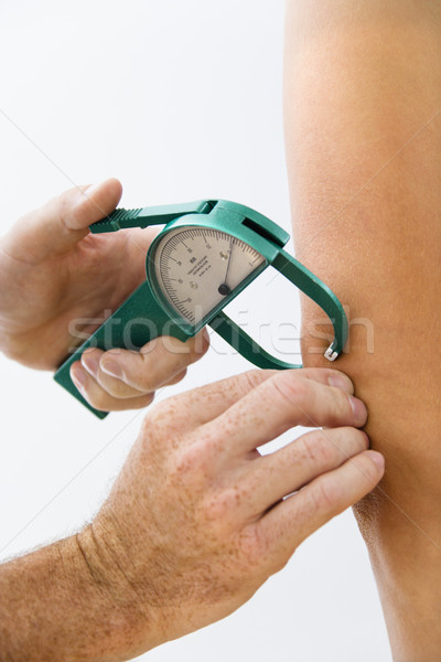 Hand using caliper. Stock photo © iofoto