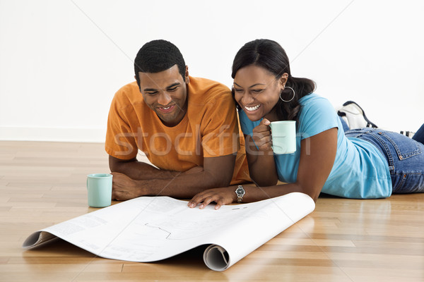 Couple with blueprints. Stock photo © iofoto