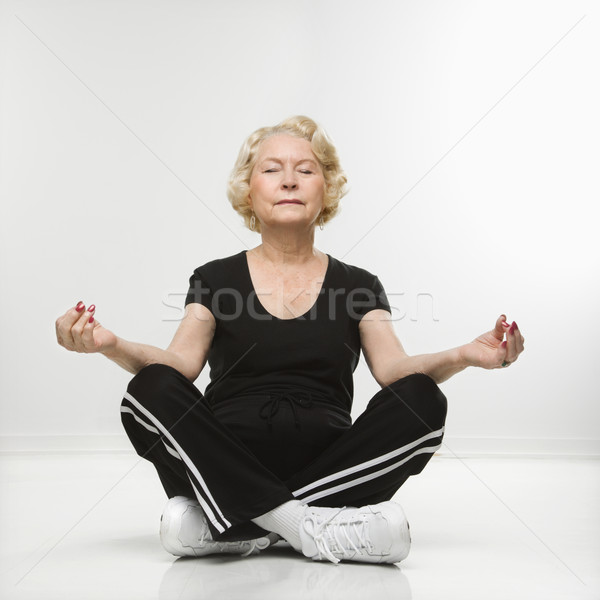 Senior woman meditating. Stock photo © iofoto