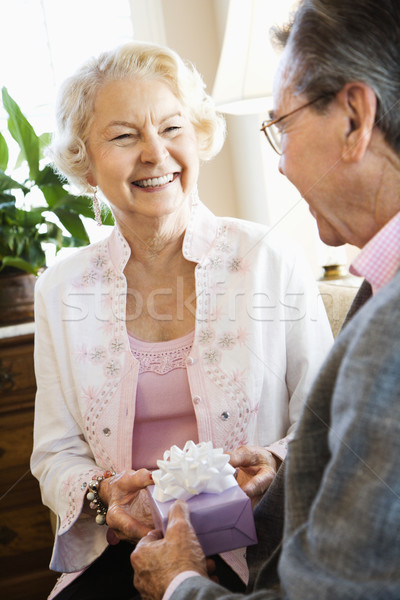 Mature couple with present. Stock photo © iofoto