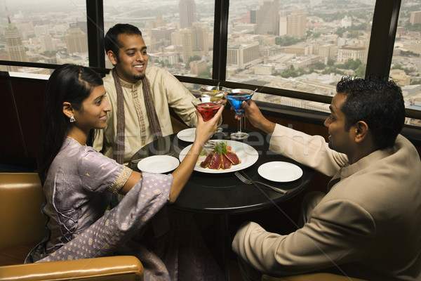 People Toasting in Restaurant Stock photo © iofoto
