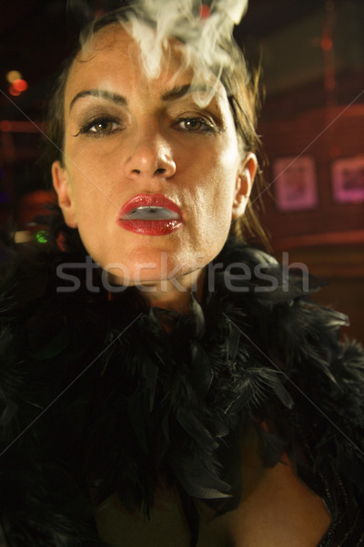 Retro woman smoking. Stock photo © iofoto