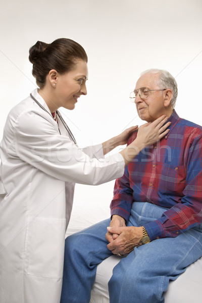 Doctor checking man's pulse. Stock photo © iofoto