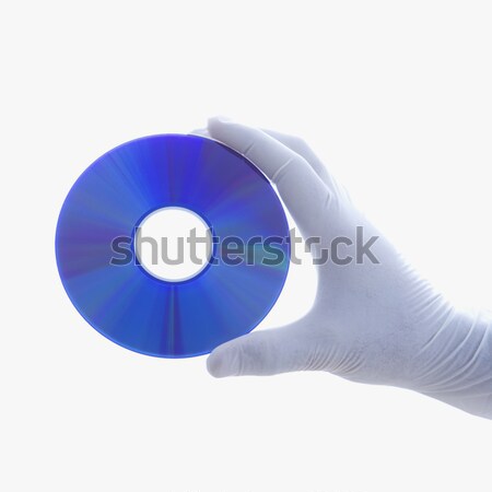 Gloved hand holding disc. Stock photo © iofoto