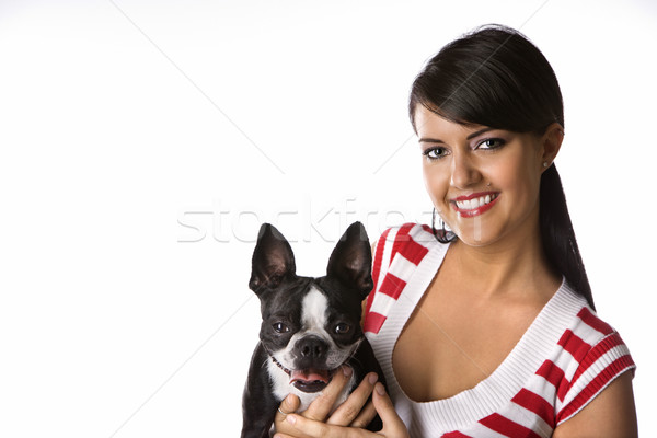 Stock photo: Woman holding Boston Terrier dog.