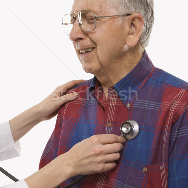 Man having physical exam. Stock photo © iofoto