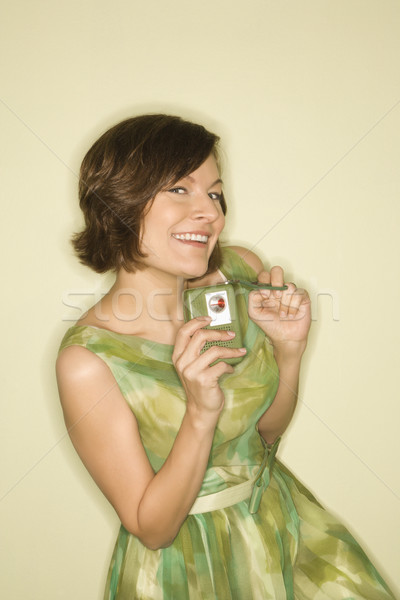 Woman with handheld radio. Stock photo © iofoto