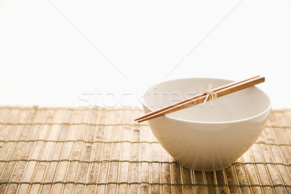 Eetstokjes lege kom geïsoleerd bamboe horizontaal Stockfoto © iofoto