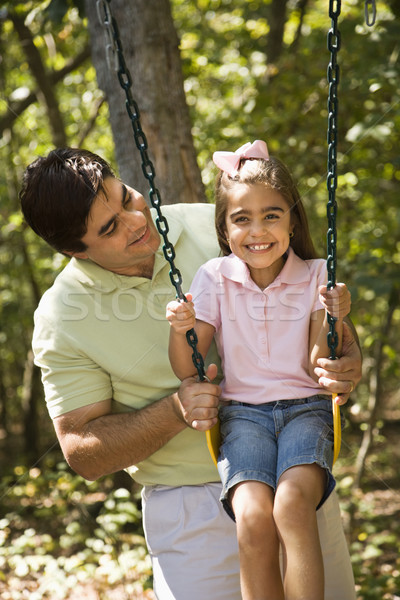 Ojciec córka hiszpańskie popychanie huśtawka dzieci Zdjęcia stock © iofoto