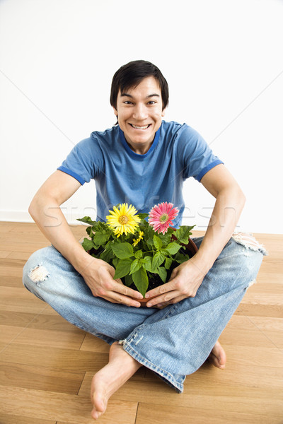 Homem flor planta asiático sessão Foto stock © iofoto