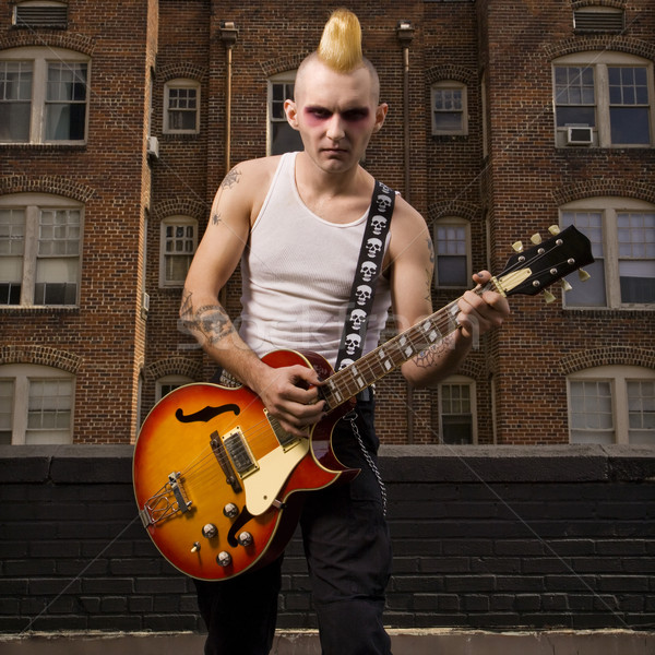 Punk jogar guitarra retrato caucasiano masculino Foto stock © iofoto