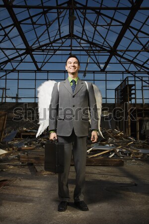 Young Businessman Standing on Stairs Stock photo © iofoto