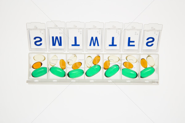 Tabletták nyitva tabletta szervező izolált összes Stock fotó © iofoto