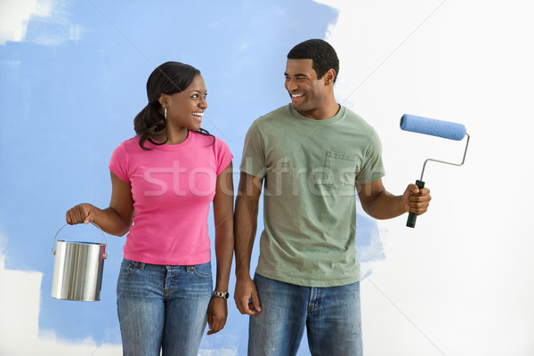 Smiling couple with paint supplies. Stock photo © iofoto