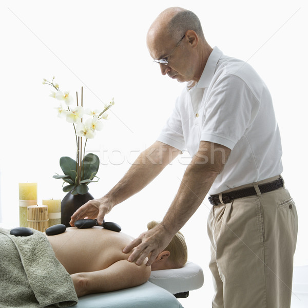 Hot stone massage. Stock photo © iofoto