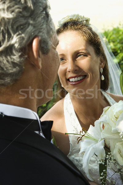 Braut Bräutigam schauen Schulter lächelnd Mann Stock foto © iofoto