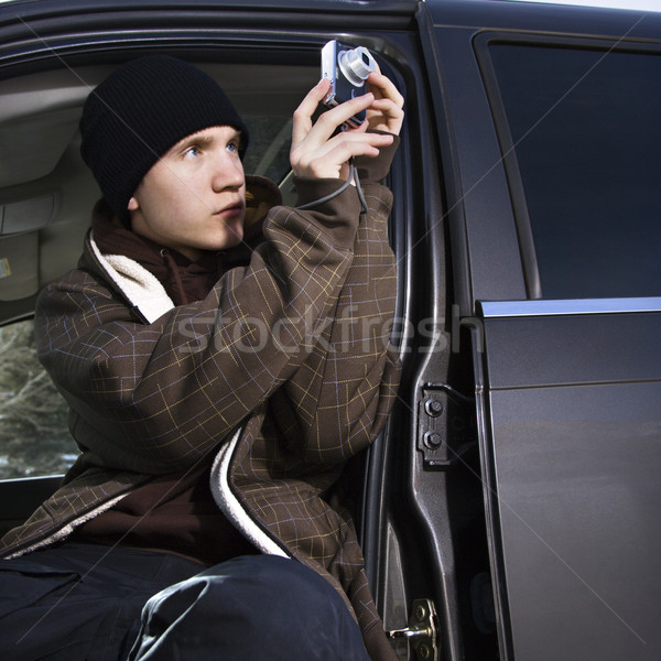 Teenager taking a picture. Stock photo © iofoto