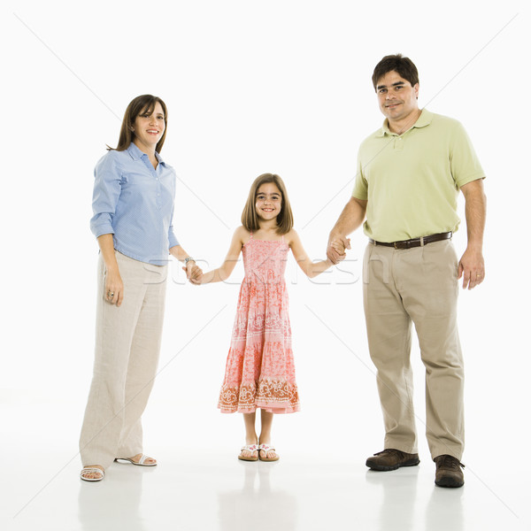 Aile el ele tutuşarak koyu esmer ebeveyn kız ayakta Stok fotoğraf © iofoto