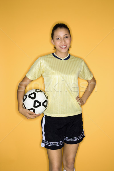 Girl holding soccer ball. Stock photo © iofoto