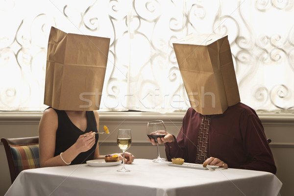 Couple wearing bags. Stock photo © iofoto
