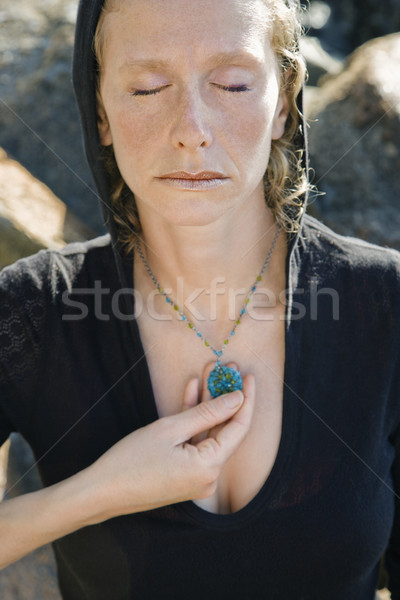 Woman with pendant. Stock photo © iofoto