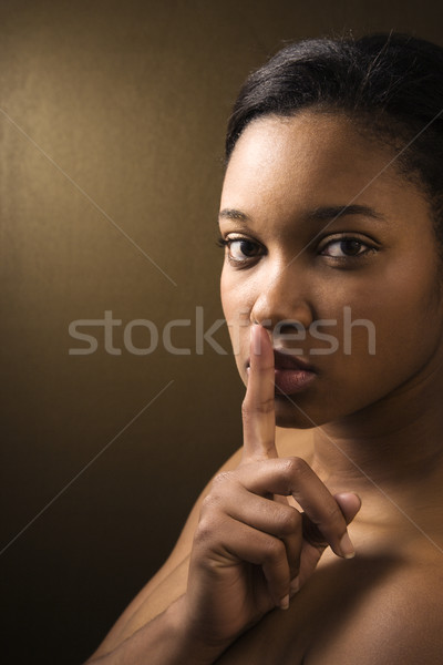 Woman shushing viewer. Stock photo © iofoto