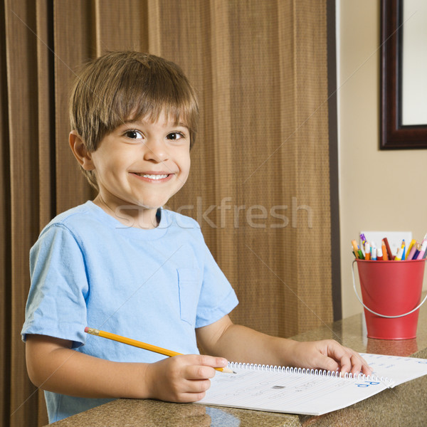 Ragazzo compiti per casa ispanico sorridere faccia ragazzi Foto d'archivio © iofoto