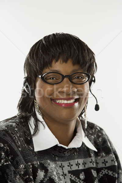 Volwassen vrouwelijke hoofdtelefoon vrouw glimlach Stockfoto © iofoto
