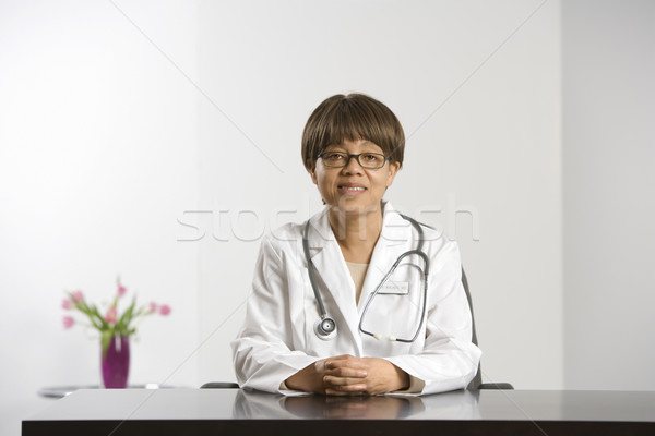 Doctor at desk. Stock photo © iofoto