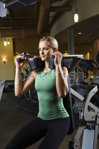 Woman working out at gym. Stock photo © iofoto