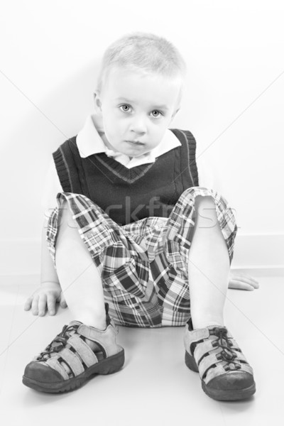 Caucasian boy sitting on floor. Stock photo © iofoto