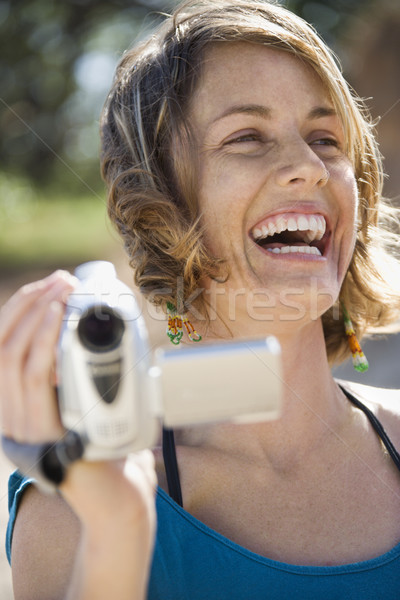 Donna videocamera esterna ridere Foto d'archivio © iofoto