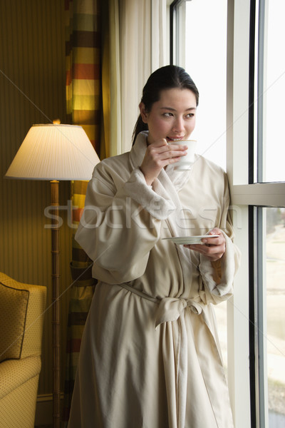 Femme potable café adulte peignoir regarder [[stock_photo]] © iofoto