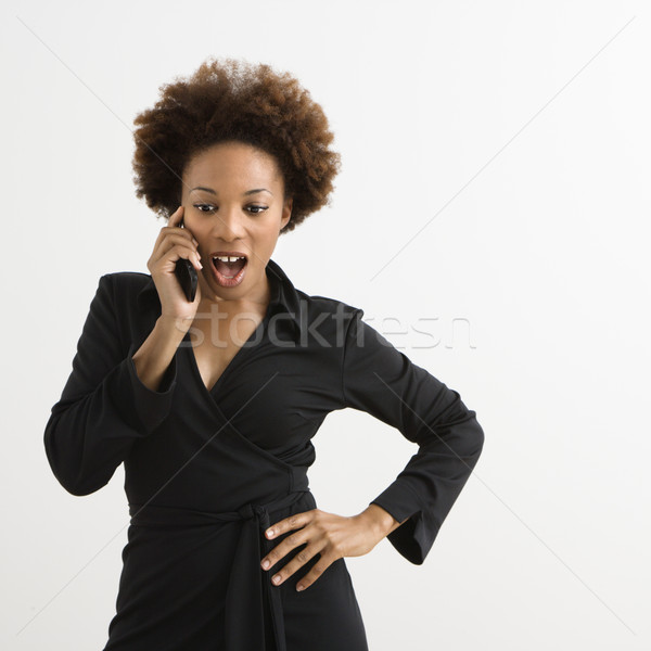 Nő mobiltelefon beszél mobiltelefon néz megrémült Stock fotó © iofoto