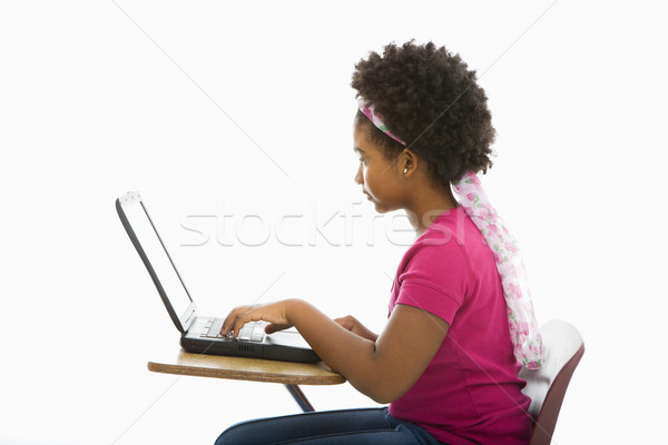 Uczennica laptop widok z boku dziewczyna posiedzenia Zdjęcia stock © iofoto
