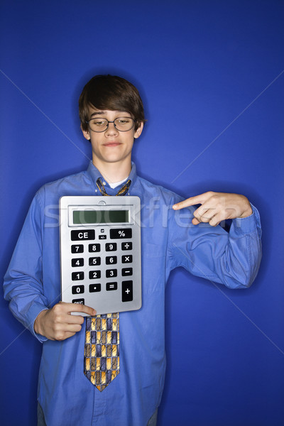 Boy holding huge calculator. Stock photo © iofoto