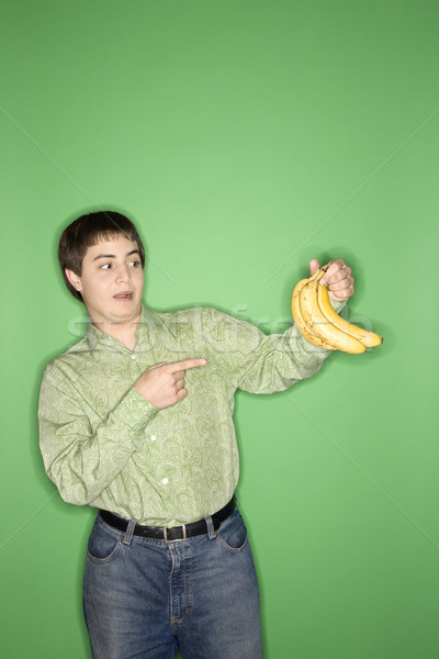 Teen boy holding bananas Stock photo © iofoto