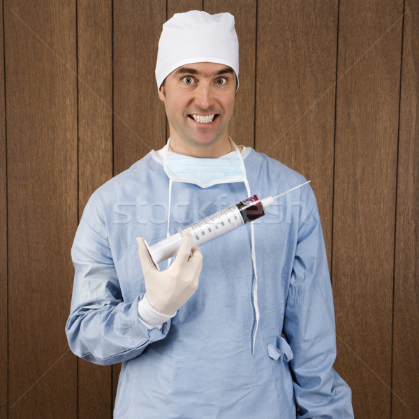 Sebész tart injekciós tű kaukázusi férfi túlméretezett Stock fotó © iofoto